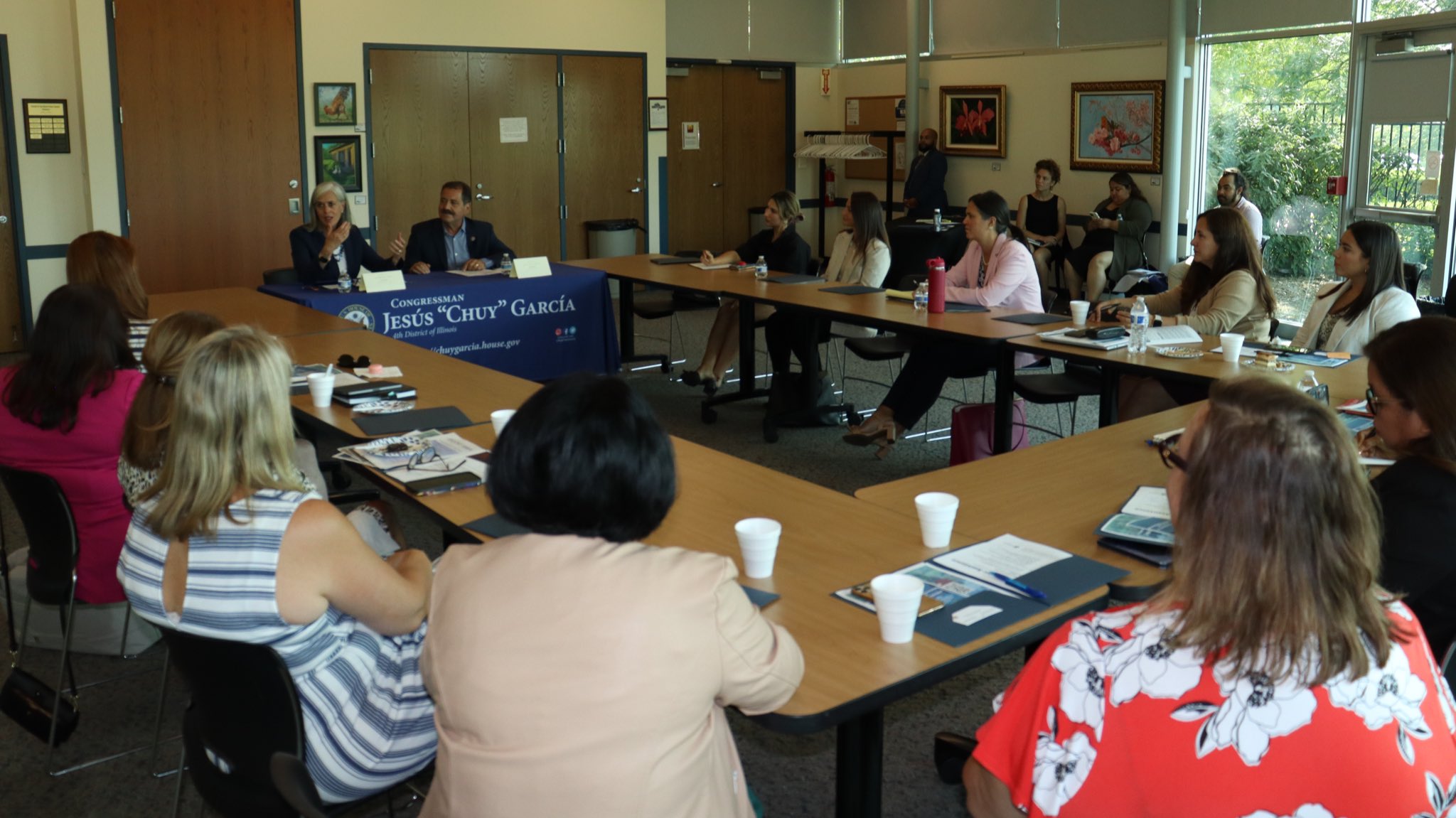 Roundtable attendees listen as Members of Congress speak