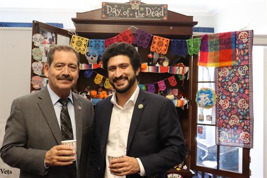 Congressman and Rep. Casar pose in front of ofrenda