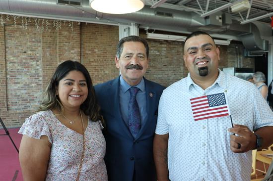 Congressman poses with a new American